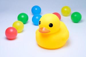 yellow rubber duck withi colorful ball