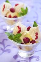 Dessert with pineapple ice cream, raspberries and meringue photo