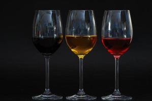 three glasses with black background photo