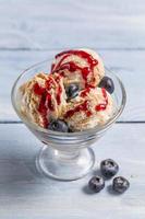 Bowl with ice cream and fresh blueberry photo