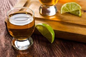 Tequila in shot glasses with lime and salt photo