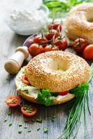 Bagels wtih cream cheese, tomatoes and chives for healthy snack photo