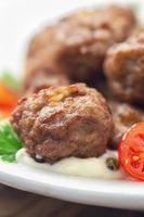 Meatballs with sauce and fresh tomatoes