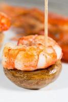 Shrimp skewer with mushrooms photo