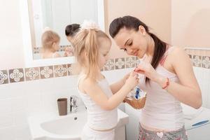 Mother and daughter in bathroom
