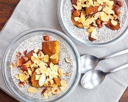 Vanilla chia seed pudding with baked prunes and nuts