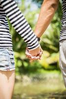 Lovely couple hold the hands photo