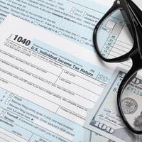 USA 1040 Tax Form with glasses