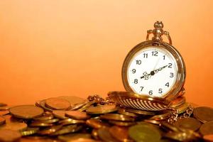Pocket watch and coins photo
