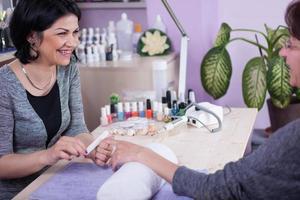 Manicure process in beauty salon