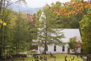 Little white church surrouneded with fall colors in the Smokies.