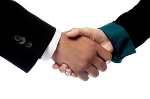 Businessmen shaking hands, closeup shot. photo