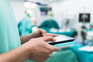 surgeon using digital tablet photo