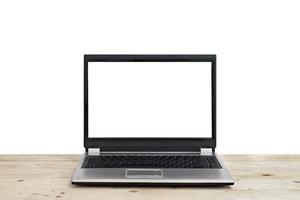 laptop with blank screen on wooden table isolated photo