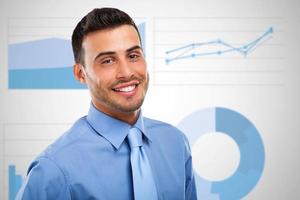 Businessman in front of business charts and diagrams photo