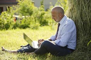 Germany, Bavaria, businessman working with laptop outdoor photo