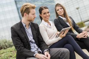 Young business people outdoors photo