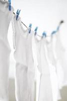 Baby singlets on clothes line photo