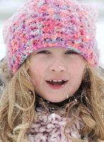 Little girl in snow scenery.