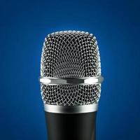 Wireless microphone on blue background