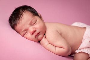 Color Image of Precious Newborn Baby Girl, on Pink Background