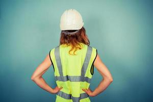 Young female engineer in high vis and hardhat photo