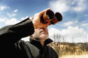 Man with  binoculars photo