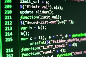 Software developer programming code on computer photo