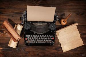 Old typewriter on wooden table photo