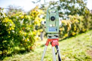 surveyor engineering equipment with theodolite and total station photo