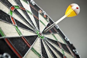 darts arrows in the target center photo