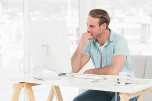 Concentrated businessman working with computer