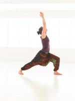 demonstration of stretching yoga posture