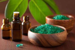 green herbal salt and essential oils for healthy spa bath photo
