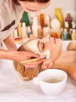 Clay facial mask in beauty spa photo
