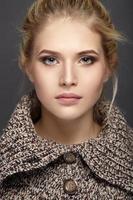 Close-up portrait of beautiful girl in knit sweater