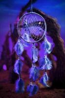 Dream catcher on a forest at night photo