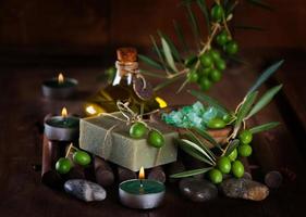 Spa and wellness setting with olive fruits
