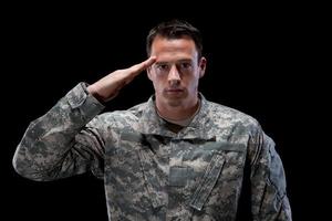 Caucasian soldier salutes photo