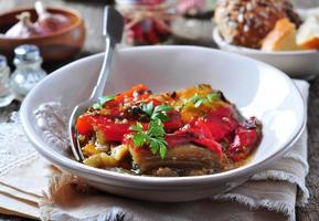 Vegetable Tian, peppers and eggplant baked with olive oil photo