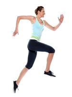 caucasian woman runner running leap full length profile