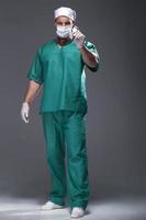 Caucasian mid adult male doctor wearing a mask