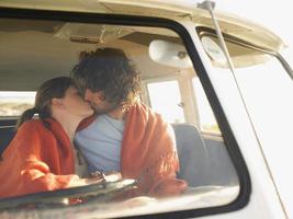 Couple Kissing In Campervan