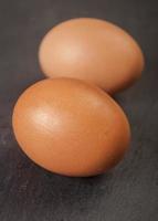 Fresh an egg isolated on black background