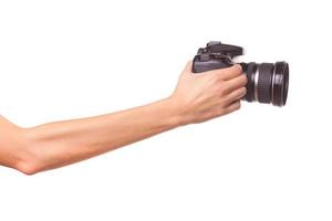 Women's hands holding the camera. photo