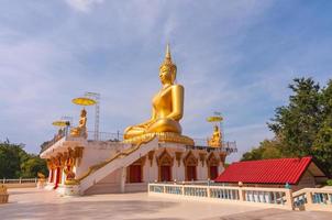 Big beautiful gold Buddha in Wat PhaThep Nimit photo