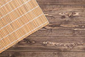 bamboo napkin on wooden table. top view