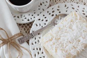 weet couscous (tapioca) pudding (cuscuz doce) with coconut and coffee photo
