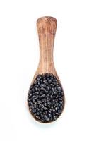 black beans in wooden spoon