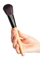 Makeup brush in hand photo